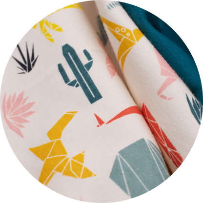 multicolor geometric plants and animals on tan fabric