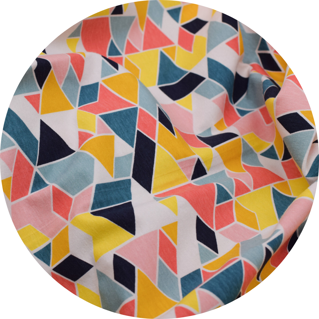 geometric multicolor shapes on cream fabric